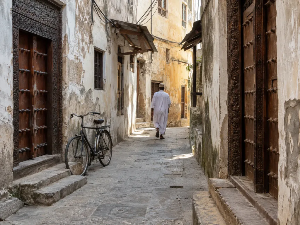 A narrow Stone Town alley lined with carved Zanzibari doors